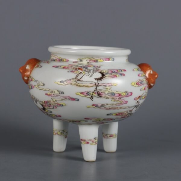 Qing Dynasty Qianlong period pink enamel cloud crane pattern three-legged furnace