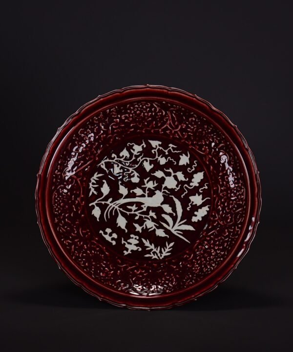 An old Ming Dynasty red and white carved flower, bird and sunflower plate