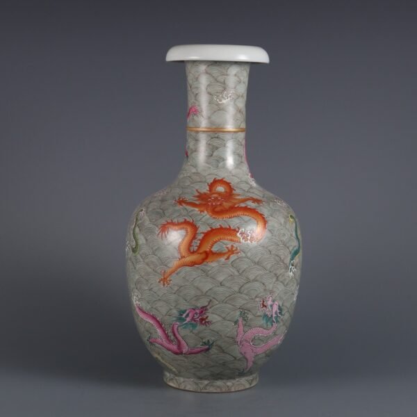 Qing Dynasty Qianlong period pink enamel seawater nine dragon pattern fan mouth vase