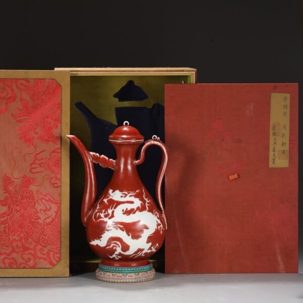 A large red-glazed pot with dragon patterns carved in white from the Yuan Dynasty.