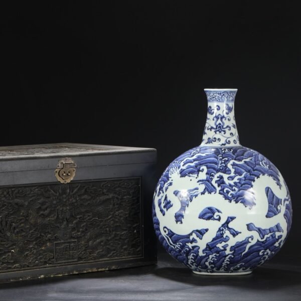 An old Ming Dynasty Xuande blue and white seawater with white carved dragon pattern large flat bottle