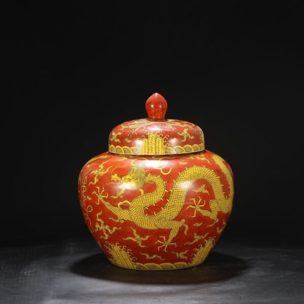 A large covered jar with red ground and yellow glaze and seawater dragon pattern from the Jiajing period of the Ming Dynasty.
