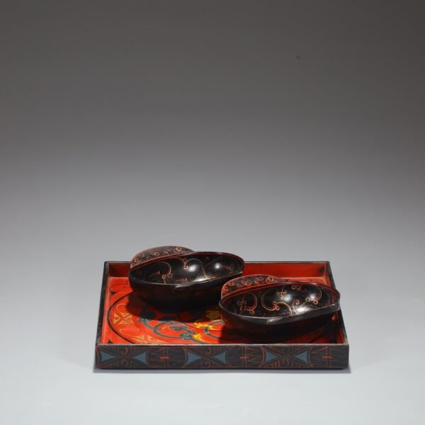 A set of lacquerware and imperial wine vessels and trays from the Han Dynasty.