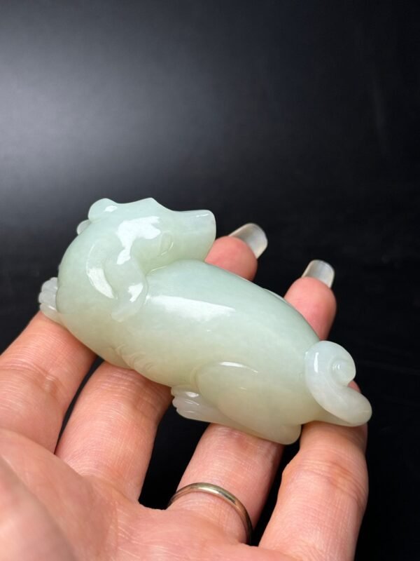 Hetian jade fortune dog hand-held ornament, which represents prosperity and wealth