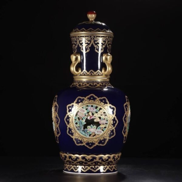 A Qing Dynasty Qianlong-era vase with a four-handled rotating lid and carved with gold