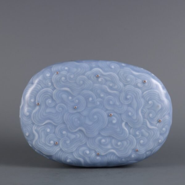 Sky blue glaze carved auspicious cloud pattern pillow made in the Qianlong period of the Qing Dynast
