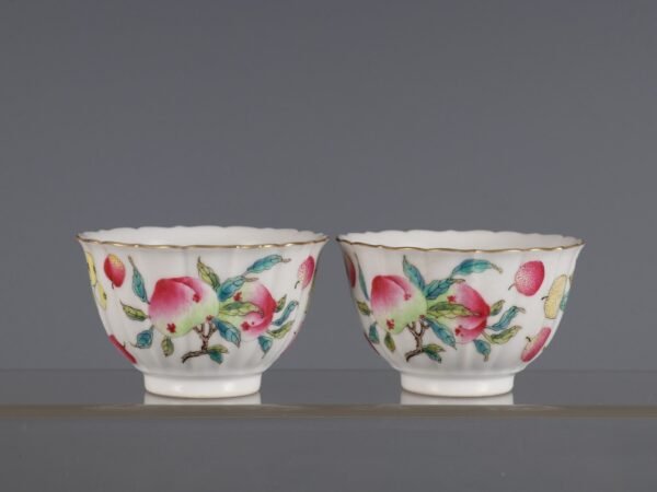 A pair of famille rose melon and fruit cups made in the Tongzhi period of the Qing Dynasty