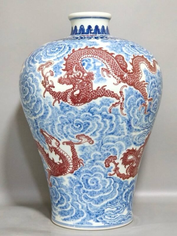 Qing Dynasty Qianlong blue and white underglaze red auspicious cloud five dragon plum vase