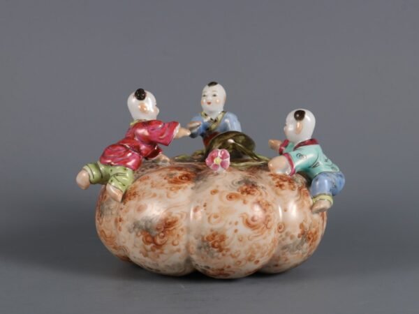 Qing Yongzheng Period Stone Glaze and Colored Boy Playing with Pumpkin Ornament