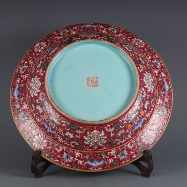 A large plate with a folded rim and rouge-red ground, enamel passionflower and gold-painted - Image 2