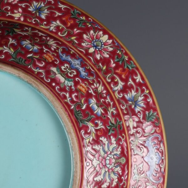 A large plate with a folded rim and rouge-red ground, enamel passionflower and gold-painted - Image 4