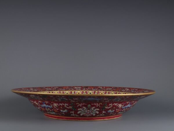 A large plate with a folded rim and rouge-red ground, enamel passionflower and gold-painted - Image 5